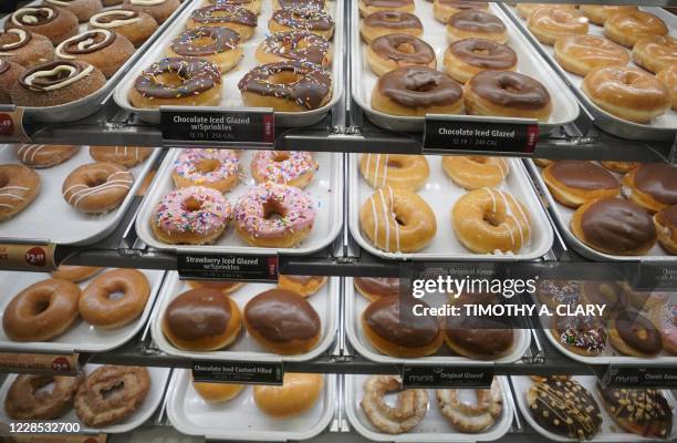 Donuts are on display inside the new Krispy Kreme flagship store amid the coronavirus pandemic in Times Square, New York, September 15, 2020. The...