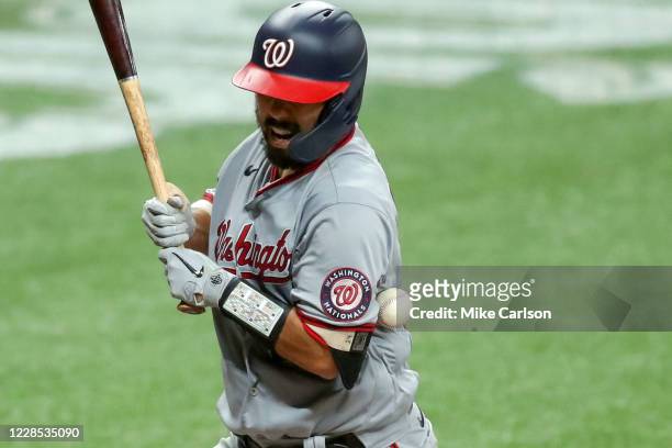 Kurt Suzuki of the Washington Nationals is hit by a pitch against the Tampa Bay Rays in the fourth inning of a baseball game at Tropicana Field on...