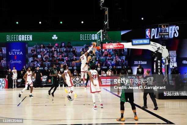 Bam Adebayo of the Miami Heat blocks a dunk attempt in the game against Jayson Tatum of the Boston Celtics in Game one of the Eastern Conference...