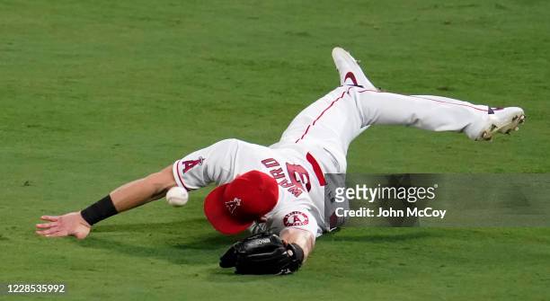 Taylor Ward of the Los Angeles Angels misses a ball hit by Carson Kelly of the Arizona Diamondbacks in the fourth inning at Angel Stadium of Anaheim...