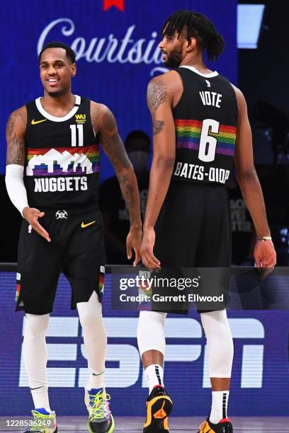 Monte Morris high-fives Keita Bates-Diop of the Denver Nuggets during Game Six of the Western Conference Semifinals of the NBA Playoffs on September...