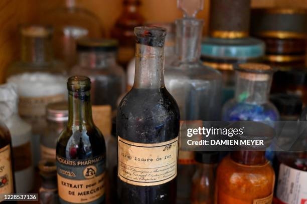 This photograph taken on September 15 shows medicine bottles on display at The Hospital Heritage Conservatory in Rennes, western France. - Pedal...