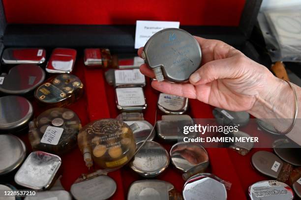 In this photograph taken on September 15 Annick Le Mescam, president of the Hospital heritage conservatory shows pacemakers at The Hospital Heritage...