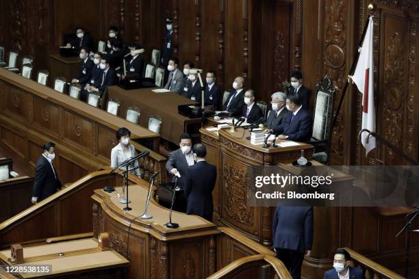 Lawmakers cast their ballots for the nomination of Japan's prime minister during an extraordinary session at the lower house of parliament in Tokyo,...