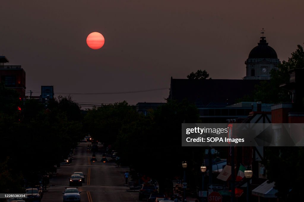 The sun sets beyond Kirkwood Avenue in a haze of smoke...