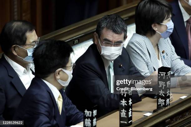 Taro Kono, Japan's defense minister, center, attends an extraordinary session at the lower house of parliament in Tokyo, Japan, on Wednesday, Sept....