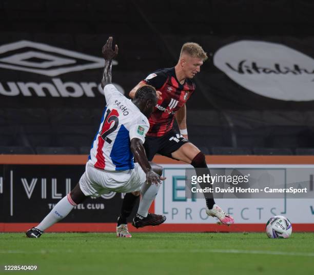 Crystal Palace's Mamadou Sakho battles for possession with Bournemouth's Sam Surridge during the Carabao Cup Second Round Northern Section match...