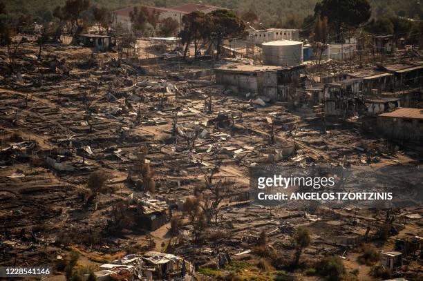 Picture taken on September 16 shows the remains of the burnt Moria migrant camp on the Greek Aegean island of Lesbos, after it was destroyed by a...