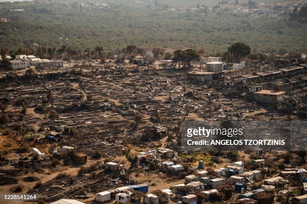 Picture taken on September 16 shows the remains of the burnt Moria migrant camp on the Greek Aegean island of Lesbos, after it was destroyed by a...