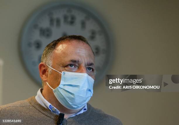 Marc Van Ranst, Belgian virologist at the Katholieke Universiteit Leuven and the Rega Institute for Medical Research, wears a face mask as he speaks...