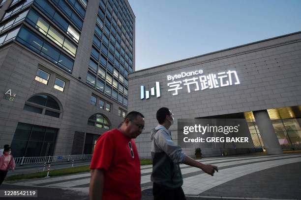 People walk past the headquarters of ByteDance, the parent company of video sharing app TikTok, in Beijing on September 16, 2020. - Silicon Valley...