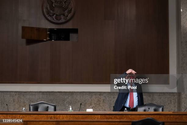 Sen. Lamar Alexander , looks across a hearing room before the start of a hearing of the Senate Appropriations subcommittee reviewing coronavirus...