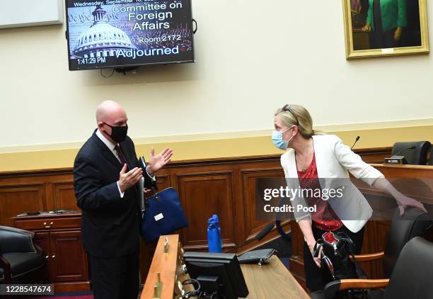 Clarke Cooper, Assistant Secretary of State for Political-Military Affairs, speaks to Rep. Abigail Spanberger after testifying before a House...