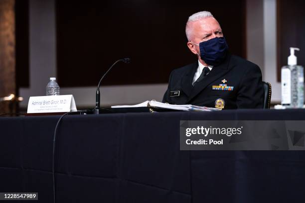 Assistant Secretary of Health and Human Services for Health Adm. Brett Giroir listens during a hearing of the Senate Appropriations subcommittee...