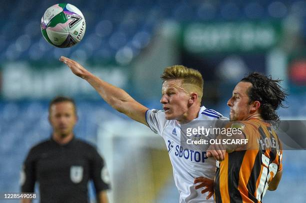 Leeds United's Polish midfielder Mateusz Bogusz vies with Hull City's English midfielder George Honeyman during the English League Cup second round...