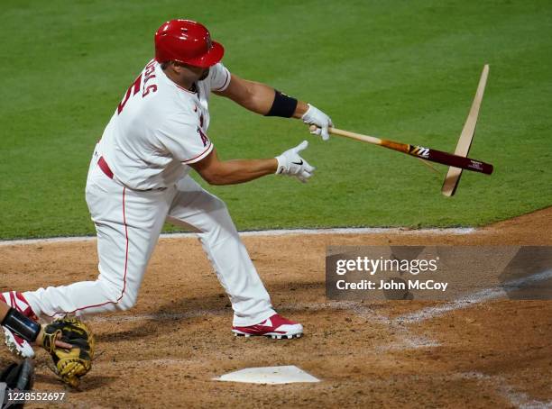 Albert Pujols of the Los Angeles Angels breaks his bat on a pitch by Taylor Clarke of the Arizona Diamondbacks in the fourth inning at Angel Stadium...