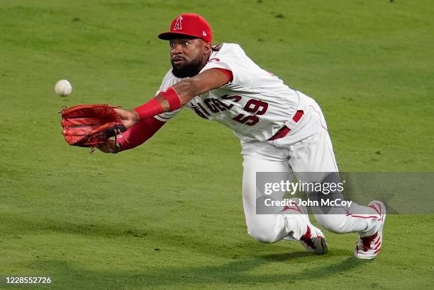 Jo Adell of the Los Angeles Angels catches a fly ball in right field hit by Daulton Varsho of the Arizona Diamondbacks in the sixth inning at Angel...