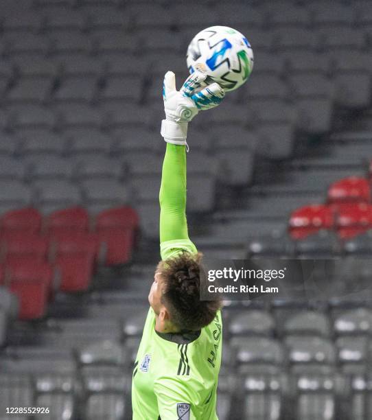 Goalkeeper Thomas Hasal of the Vancouver Whitecaps makes a fingertip save against the Montreal Impact during MLS soccer action at BC Place on...
