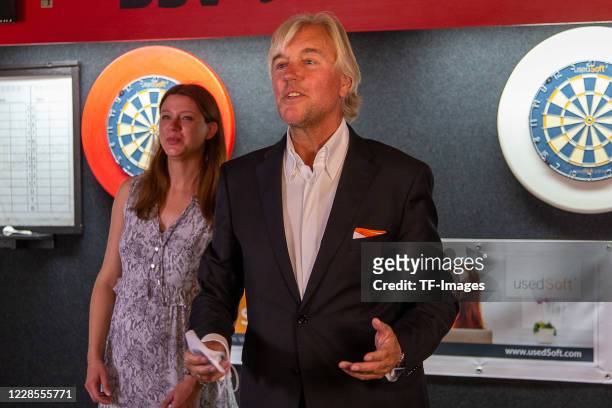 Jennifer Schneider and CEO Peter Schneider of usedSoft are seen during the Photocall with Fallon Sherrock on September 16, 2020 in Dortmund, Germany.