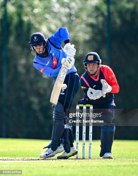 Down , United Kingdom - 17 September 2020; Lorcan Tucker of Leinster Lightning plays a shot as Gary Wilson of Northern Knights attempts to field the...
