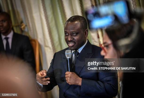Ivory Coast former rebel leader and Prime Minister Guillaume Soro answers journalists' questions after addressing a press conference on September 17,...