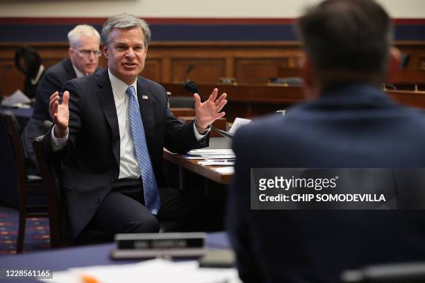 Director Christopher Wray speaks to Congressman Mike Garcia of California during testimony before a House Homeland Security Committee hearing about...