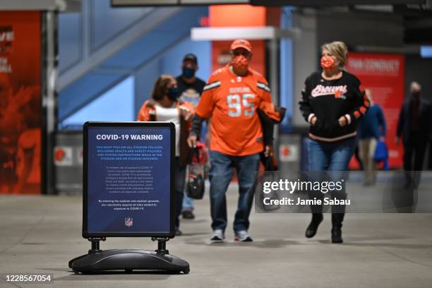 Signage inside FirstEnergy Stadium reminds fans of the dangers of Covid-19 before an NFL game between the Cleveland Browns and the Cincinnati Bengals...