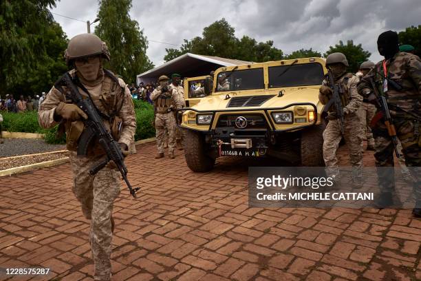 The armoured vehicle of Colonel Assimi Goita , president of the CNSP , arrives at the funeral of former Mali President General Moussa Traore in...