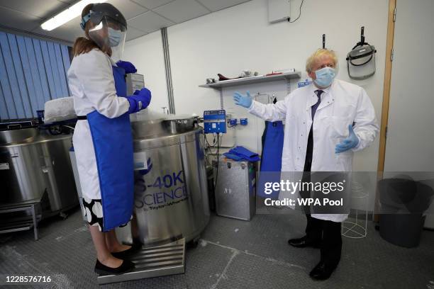 Britain's Prime Minister, Boris Johnson is shown samples stored in liquid nitrogen by Professor Kate Ewer during a visit to the Jenner Institute on...