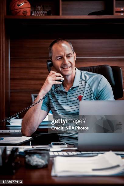 Vice president of basketball operations of the Chicago Bulls, Arturas Karnisovas, talks on the phone in his office on August 19, 2020 in Chicago,...