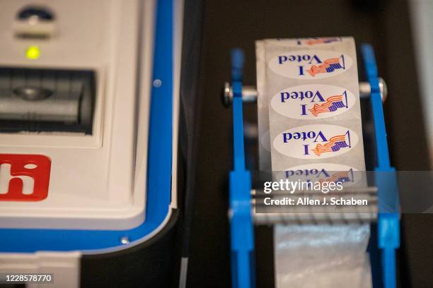 View of I Voted stickers and voting machine on display at the "Super Vote Center Site" for walk-in and drive-thru voting starting Oct. 30th at the...