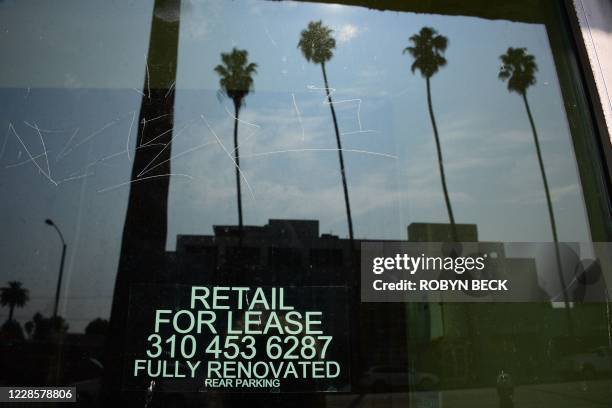 Empty storefront shop with "For Lease" signs are seen on Santa Monica Blvd in Los Angeles on September 17, 2020 during the economic downturn caused...