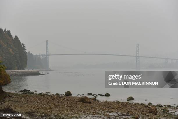 Stanley Park and Lions Gate Bridge are covered in smog from clouds and smoke due to forest fires in Washington, Oregon and California, September 17...