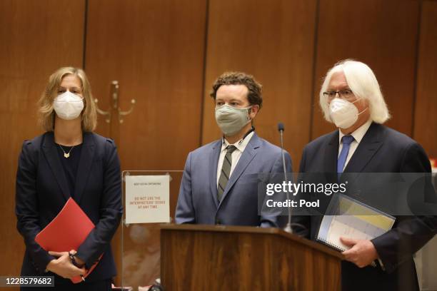Actor Danny Masterson stands with his lawyers Thomas Mesereau and Sharon Appelbaum as he is arraigned on rape charges at Clara Shortridge Foltz...