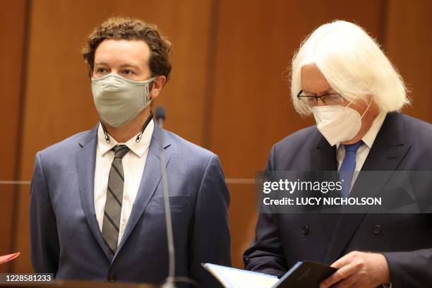 Actor Danny Masterson stands with his lawyer Thomas Mesereau as he is arraigned on three rape charges in separate incidents between 2001 and 2003, at...