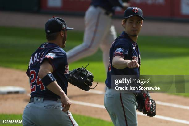 Minnesota Twins pitcher Kenta Maeda reacts with third baseman Josh Donaldson after he get Tim Anderson grounded out to third to end the fifth inning...