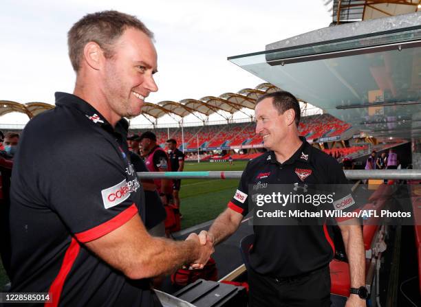 Ben Rutten, Senior Assistant Coach and Team Defence of the Bombers and John Worsfold, Senior coach shake hands after the 2020 AFL Round 18 match...