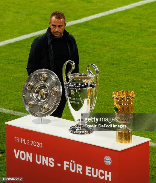 Head coach Hansi Flick of Bayern Muenchen for the Master Bowl, Champions League Cup and DFB Cup are seen prior to the Bundesliga match between FC...