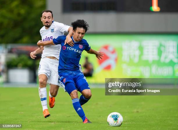 Lee Ka Yiu of Eastern Long Lions fights for the ball with Daniel Cancela Rodriguez of Kitchee during the Hong Kong Premier League match between...