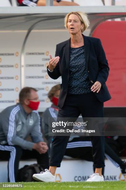 Head coach Martina Voss-Tecklenburg of Germany gestures during the UEFA Women's EURO 2022 Qualifier between Germany Women's and Ireland Women's at...