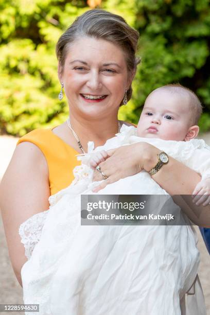 Hereditary Grand Duchess Stephanie of Luxembourg with their son Prince Charles of Luxembourg at the baptism ceremony at the L'Abbaye St Maurice on...