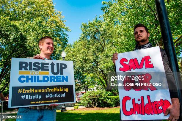 Demonstrators in Keene, New Hampshire, gather at a "Save the Children Rally" to protest child sex trafficking and pedophilia around the world, on...