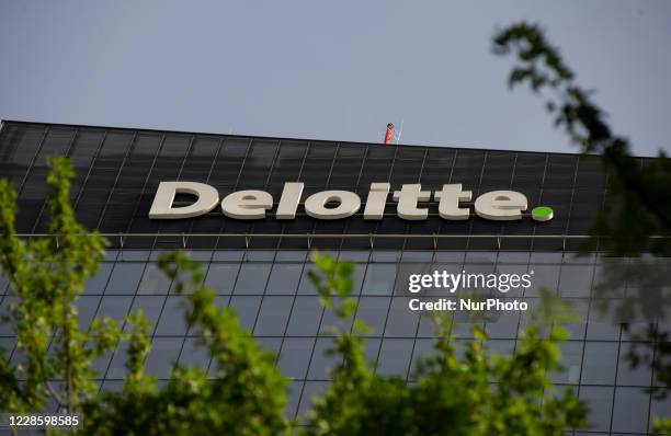 Multinational professional services network company Deloitte sign is seen on top of the Q22 offices complex on September 19, 2020 in Warsaw, Poland.