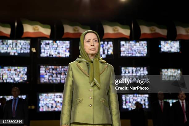 Maryam Rajavi, President-elect of the National Council of Resistance of Iran , standing, during the signing of Iran original national anthem, - Iran,...