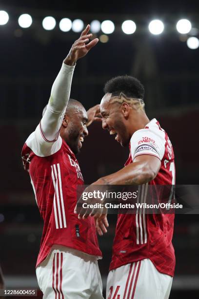 Alexandre Lacazette of Arsenal celebrates with teammate Pierre-Emerick Aubameyang of Arsenal after scoring their 1st goal during the Premier League...