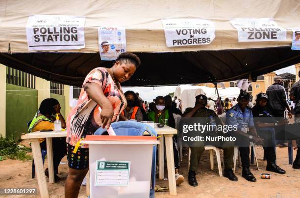 Woman prepares his ballot to cast as voting in the Edo State governorship election commence at polling unit 26, ward 5, Iguododo, Orhionmwon Local...