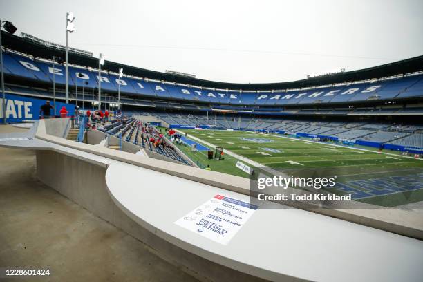 Signs encouraging social distancing are seen throughout the stadium prior to the Louisiana-Lafayette Ragin Cajuns vs. Georgia State Panthers game at...