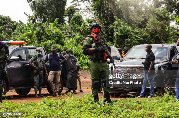 Man of the Nigerian Police Force Stand on guard at a polling unit during the Edo State governorship election in Benin City area of Edo State. As...