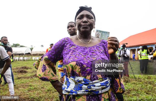 Woman display her permanent Voters Card before casting her vote at polling unit 26, ward 5, Iguododo, Orhionmwon Local Government Area, in Edo State,...