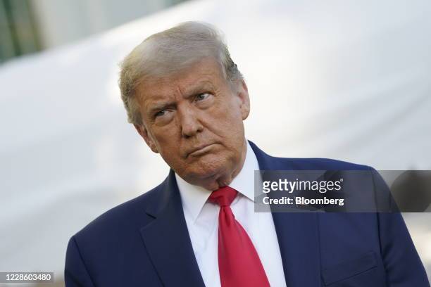 President Donald Trump listens to a question before boarding Marine One on the South Lawn of the White House in Washington, D.C., U.S., on Saturday,...